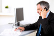 Business man conversing on mobile