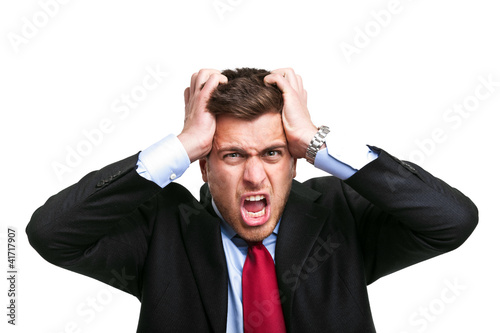 Photo: Portrait of a despairing businessman Portrait of a despairing businessman