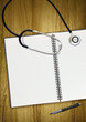 stethoscope notepad and pen