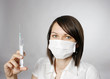 Doctor in mask with syring