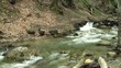 Rapid river with small waterfalls.