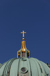 Cross made of gold on top of Berlin Cathedral