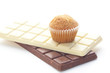 bar of chocolate and muffin isolated on white
