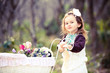 Photo: Pretty young girl with spring flowers Pretty young girl with spring flowers