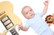Baby boy laying with guitar