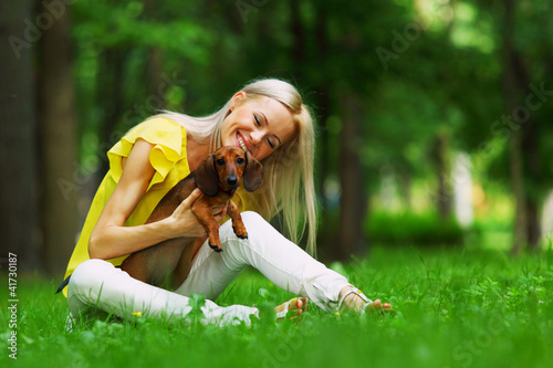 Photo: woman dachshund in her arms woman dachshund in her arms