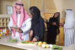 arabian couples gathering cooking & drinking coffee in kitchen