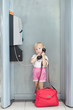 child talking the phone in the airport