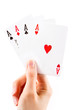 Aces being held over white