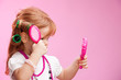 Little girl playing a hairdresser