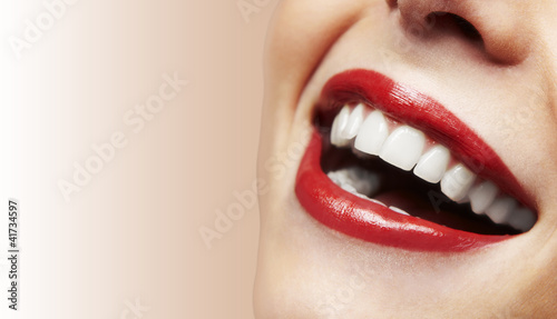 Photo: Woman smiling with great teeth on white background Woman smiling with great teeth on white background