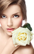 young beautiful girl with perfect skin  and a rose