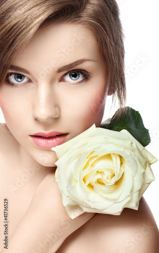 Photo: young beautiful girl with perfect skin and a rose young beautiful girl with perfect skin and a rose