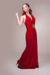 Beautiful young woman wearing a sexy red evening dress