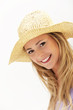 Attractive woman in straw hat