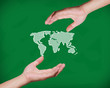 hands pointing earth on the blackboard. hands pointing earth on the blackboard.