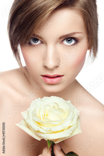 Photo: young beautiful girl with perfect skin and a rose young beautiful girl with perfect skin and a rose