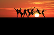 silhouette of gymnasts in sunset