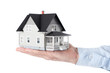 Foto: Hand holding house architectural model, isolated Hand holding house architectural model, isolated