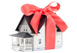 Foto: House architectural model with red bow House architectural model with red bow