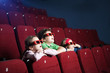 Photo: Excited kids watching cartoon in the 3D movie theater Excited kids watching cartoon in the 3D movie theater