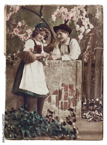 Photo: CIRCA 1920.Antique postcard: two children. CIRCA 1920.Antique postcard: two children.