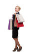 Foto: Young business woman in a black suit holding shopping bags Young business woman in a black suit holding shopping bags