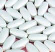 white pill on pink background