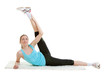 Young fitness girl exercising in the gym