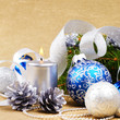 Blue and white christmas balls with silver candle