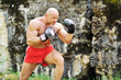 Young boxerman training outdoors