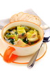 Fish soup in a bowl on a white background.
