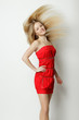 Fashion model posing with hair fluttering in the wind
