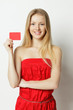 Photo: Young smiling woman holding credit card Young smiling woman holding credit card
