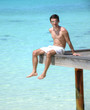 Photo: Man sitting on a jetty (Maldives) Man sitting on a jetty (Maldives)