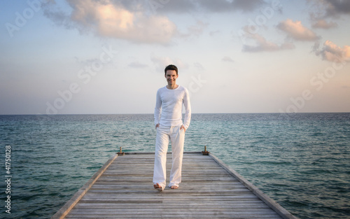 Photo: Man standing on a jetty (Maldives) Man standing on a jetty (Maldives)