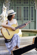 young woman with guitar