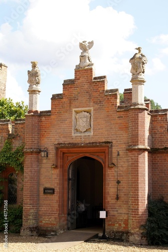 Photo: decorative entrance with coat of arms and statues decorative entrance with coat of arms and statues