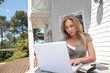 Woman working at home on laptop computer Woman working at home on laptop computer