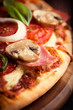 Closeup of Pizza with Ham and Mushrooms