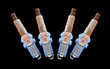 Photo: spark plugs in a group of 4, on black spark plugs in a group of 4, on black
