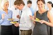 Foto: Smiling business woman during company lunch buffet Smiling business woman during company lunch buffet