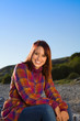 Confident Woman Sitting and Smiling