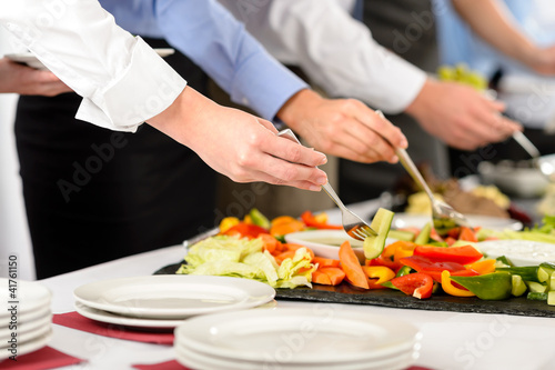 Photo: Business catering people take buffet food Business catering people take buffet food