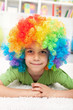 Young boy with clown wig