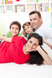 Young family portrait in their home