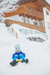 The boy goes for a drive on an snow slope. The boy goes for a drive on an snow slope.