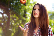 Beautiful woman  in the garden with apples
