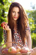 Beautiful woman  in the garden with apples