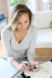 Woman typing message on smartphone